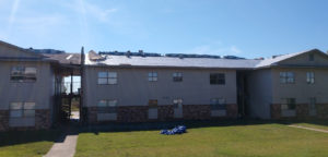 Re-decking and roof installation on apartment buildings.